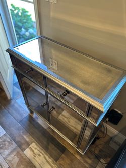 Mirrored storage cabinet
