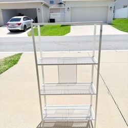 Metal shelving unit with 4 shelves for sale.