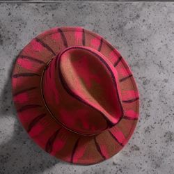 pink wool hat with dark accents 