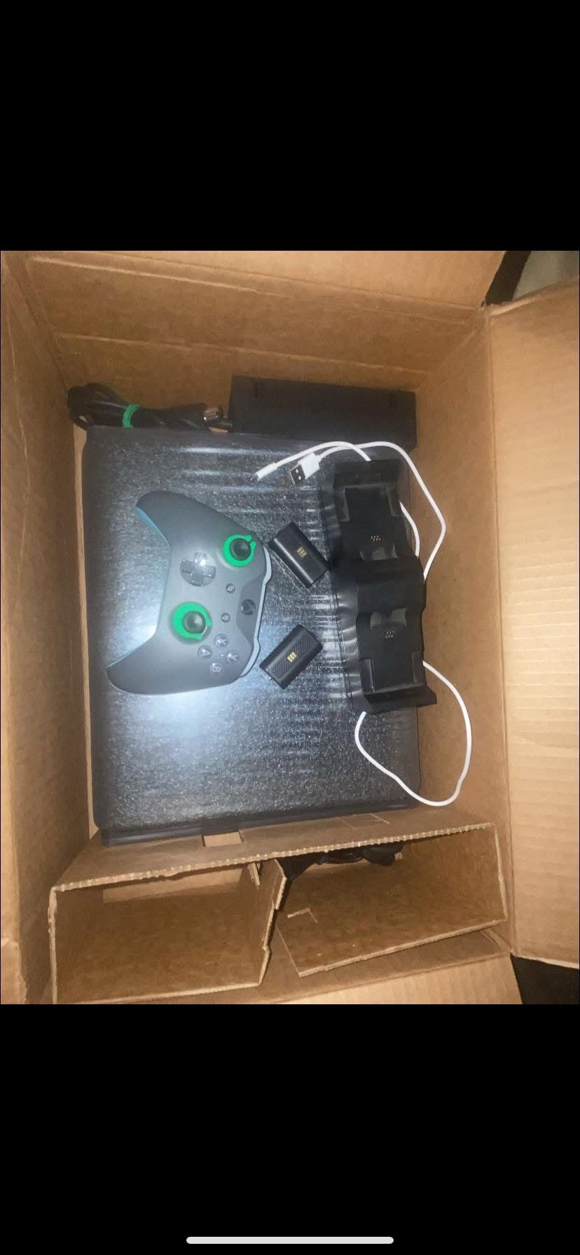 Xbox One X with two rechargeable batteries, a charging dock all cables one controller it’s new