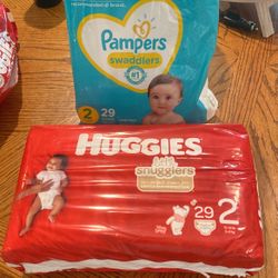 Size 2 Diapers And 2 Packs Of Wipes