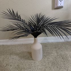 Decorative vase with black palm stems