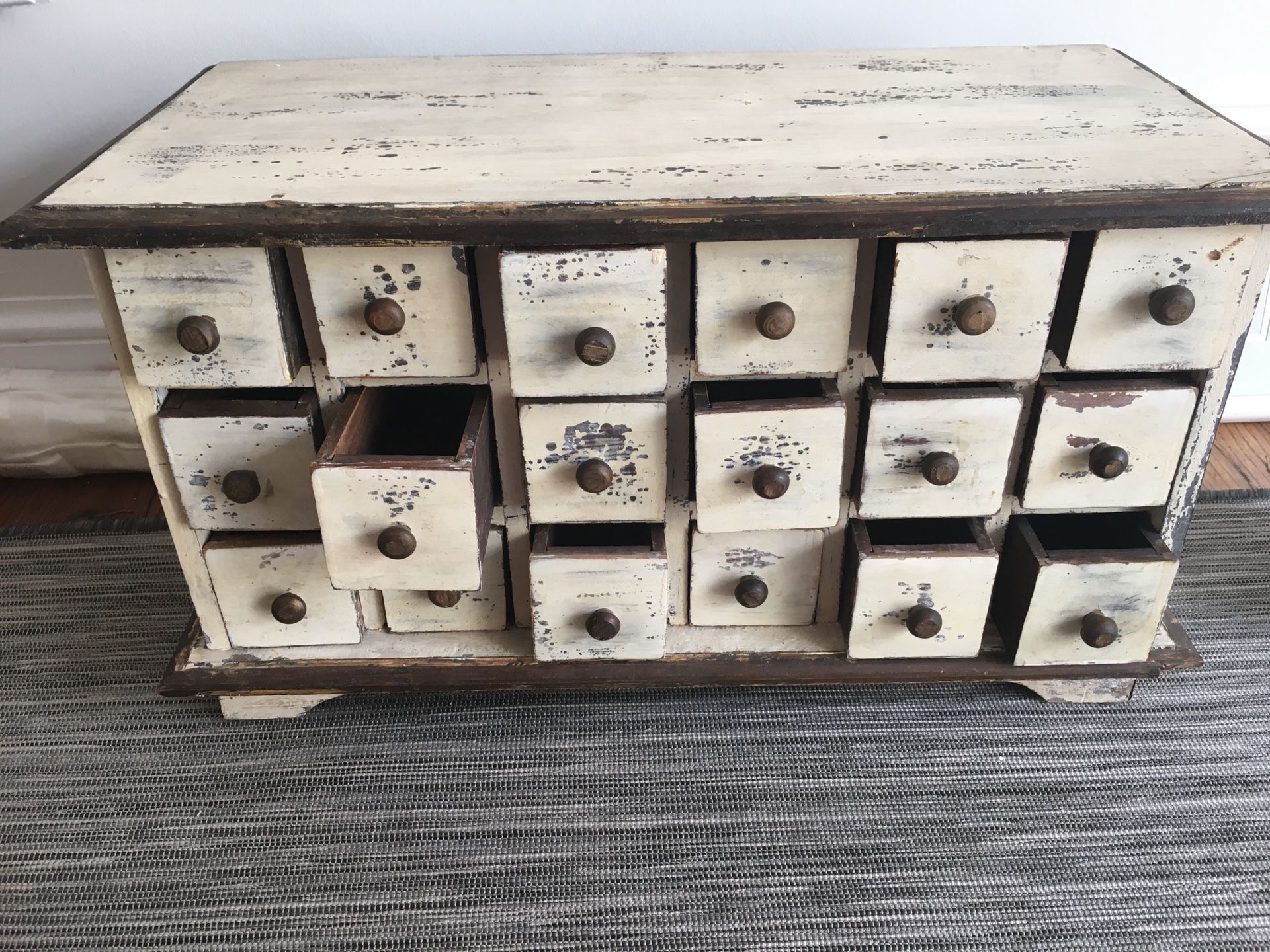 Antique wooden drawer with multiple small drawers