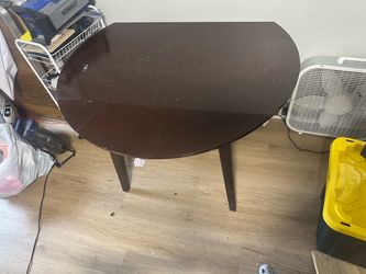 Dining table with two extendable sides