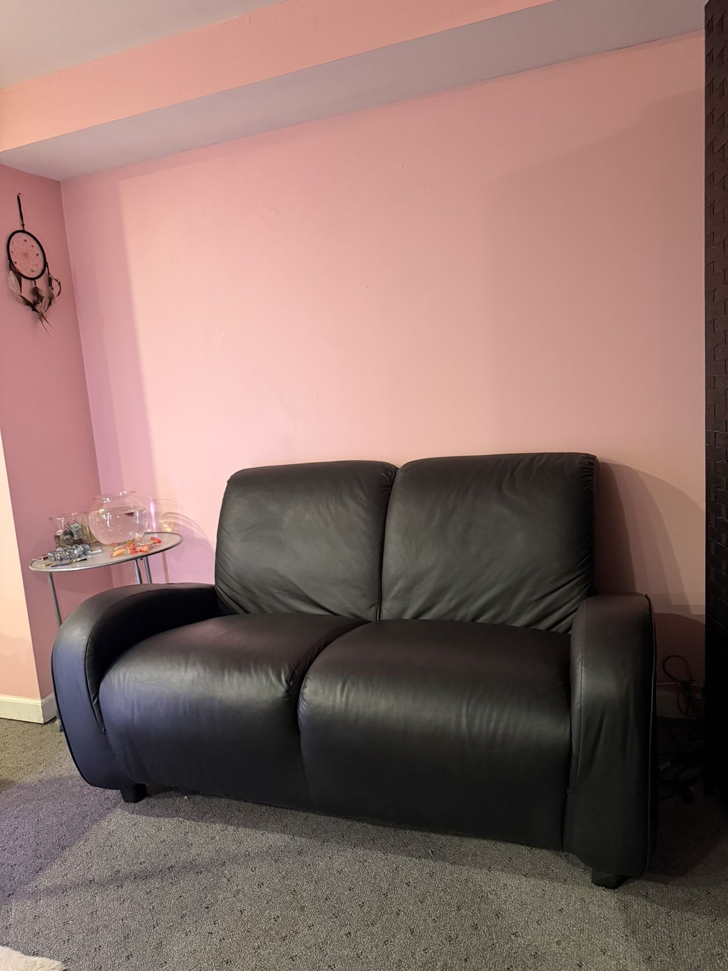 Black leather small couch 