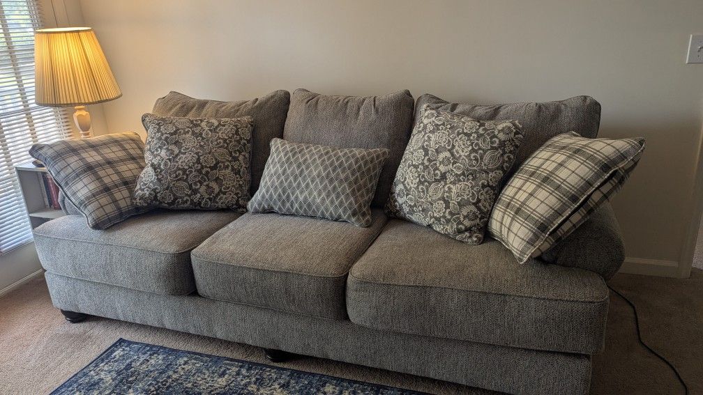 Grey Couch With Decorative Cushions