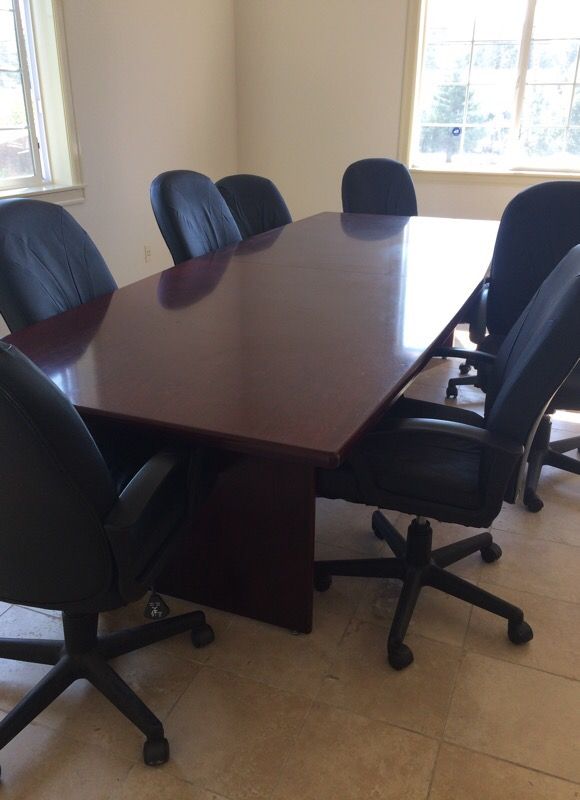 Beautiful mahogany conference table with a glossy finish and include 8 chairs