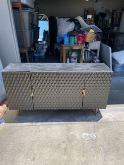 Black and gold entertainment console.