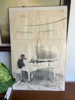 John Lennon playing a white grand piano, which was originally included as an insert in his 1971 solo album Imagine