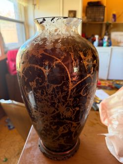VASE 8"w x 14"tall (black & gold); cross streets are Arapaho & Waterview