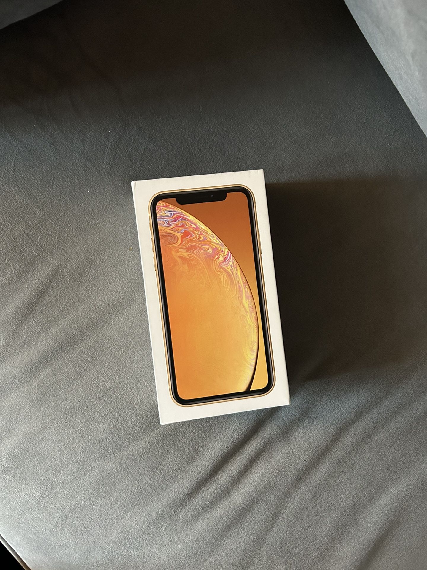 Apple iPhone XR - 64GB UNLOCKED RARE COLOR WITH OTTER BOX AND AN EXTRA CHORD