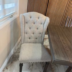 A dinning table with 8 chairs