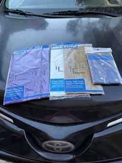 5 Brand New Plastic Tablecloths. 