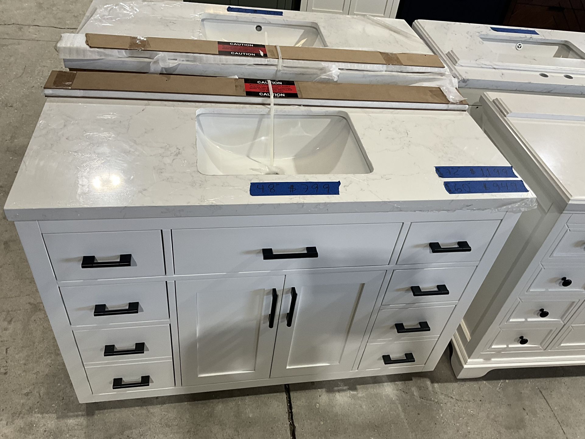 48” Bathroom Vanity in white , single sink soft close solid wood with vanity top in white  $799  Luke’s liquidations warehouse Address:  2434 N Forsyt