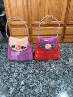 Ceramic Purse Handbag with Bead Handles Pair of Salt and Pepper Shakers.  Size approximately 3 inches tall without handles and 3 1/2 inches wide.  Bra
