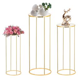 Selling 3 piece display stands. Tall 39”, 31”,24”. Gold metal pedestals assembled