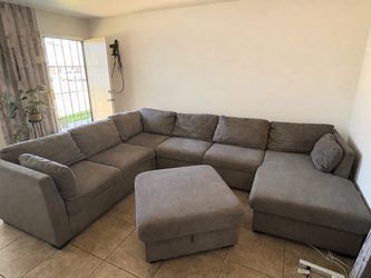 Light grey couches, brand is Ashley