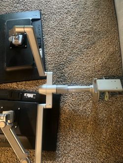 Human scale dual monitor arms