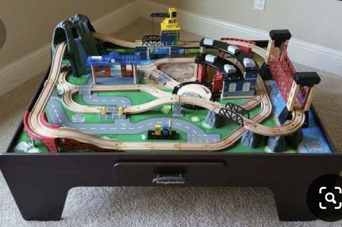 Train table with tracks and trains