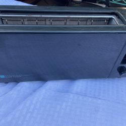 Oster Cool Touch Long Oster Cool Touch toaster. This model features a cool-touch exterior designed to reduce the risk of burns during normal use. 