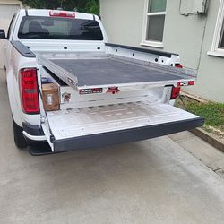 Roll out truck bed tray
