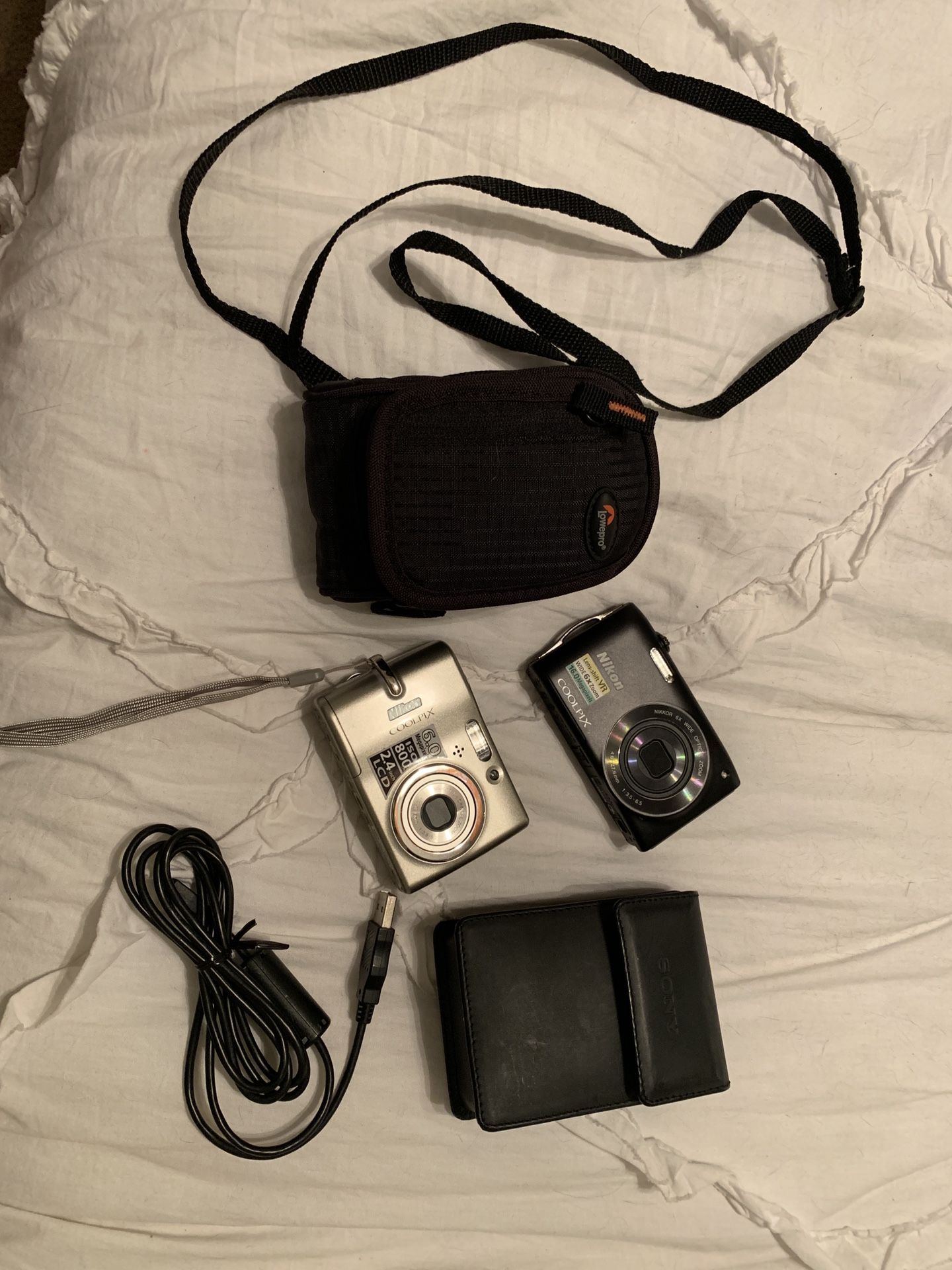 Two small Nikon Coolpix cameras