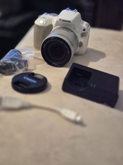 Canon EOS rebel sl2 with 18-55mm lens