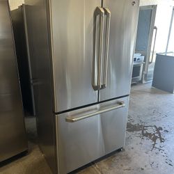 Fully Wrapped stainless steel GE Cafe™ Series 20.7 Cu.Ft. Counter-Depth Frenchdoor Water and icemaker inside can deliver  Retail price $3000