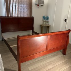 Cherry wood sleigh bed , wood rail slide in on one side needs repair that’s why it’s inexpensive but no scratches or chips anywhere else