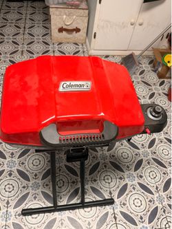 COLEMAN PORTABLE GRILL (NEVER USED)