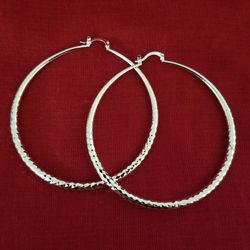 Large silver tone hoop earrings. (Pick Up Only)