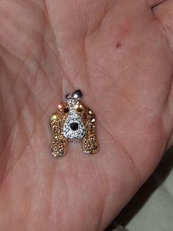 Basset Hound pendant from Scamper & Co is crafted from sterling silver and features sparkling brown and white crystals
