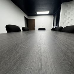 Office conference table with chairs