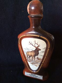 Four Vintage Jim beam James Lockhart wildlife bottles