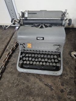 Two Antique Royal Typewriters. Black and Silver.