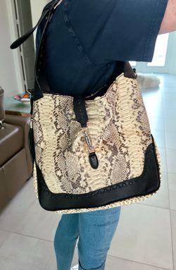 STUNNING NEW/NEVER USED VERA PELLE PYTHON SNAKE WITH BLACK CALFSKIN PARTS AND STRAP. SILVER HARDWARE AND ADJUSTABLE STRAP. MADE IN ITALY. 16"H x 15"W.