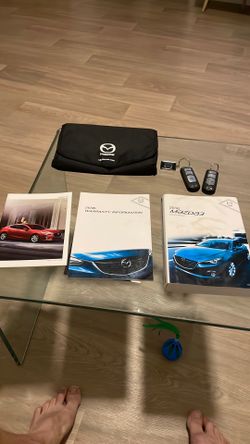 2016 Mazda 3 owner’s manual and 2 working OEM key fobs
