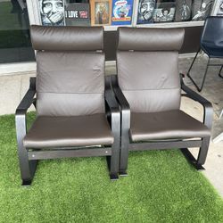  IKEA POÄNG armchairs, which feature a distinctive bentwood frame and a comfortable, cushioned seat and back