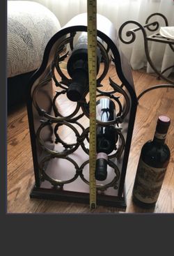 Beautiful Bombay wine rack. Dark wood and brass.