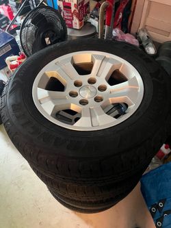 265 65 18 Silverado rims Tires Good Year Wrangler