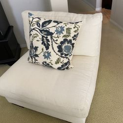 White couch with metal piece that can be taken apart to make two seating areas in good condition