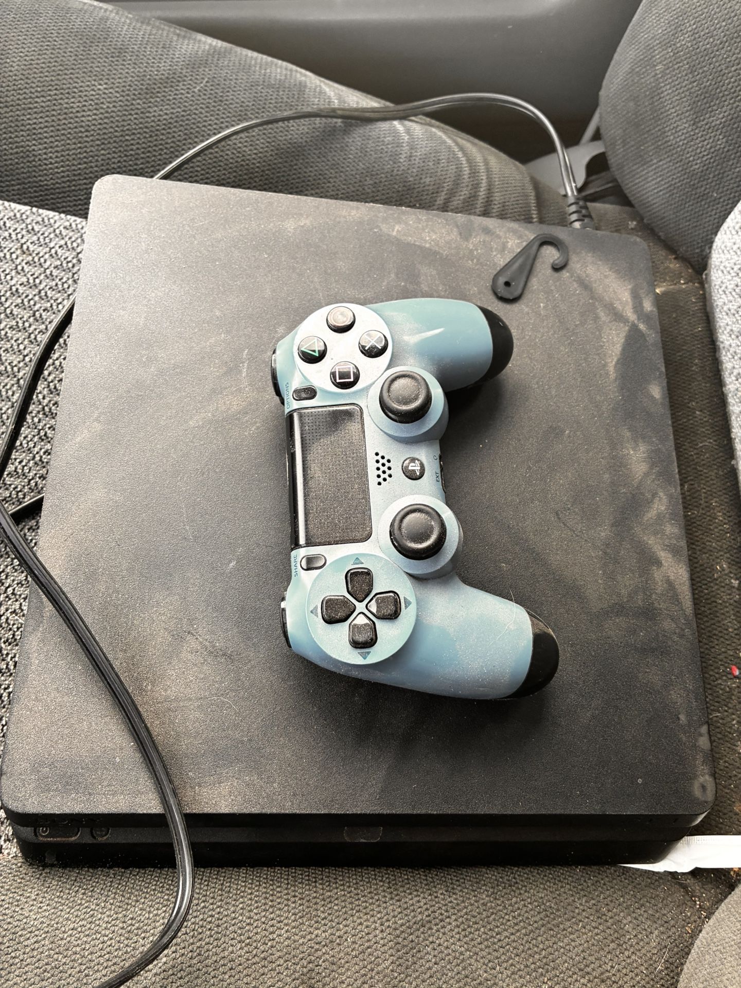 PS4 with controller and chords