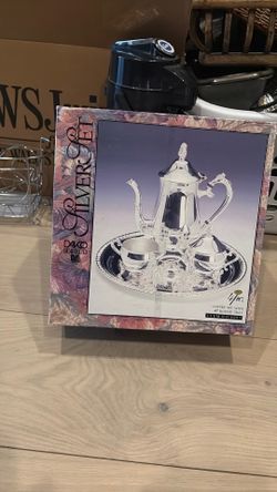 Silver coffee set with round tray