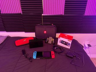 Nintendo Switch 1 + Sonic split pad controller, Red Mario case, and a Game Traveler deluxe system case