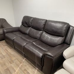 Well loved real leather sofa couch with power recliners