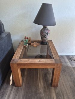 Wooden side table with glass top