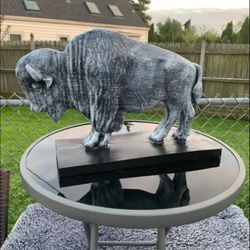 The old gray buffalo statue