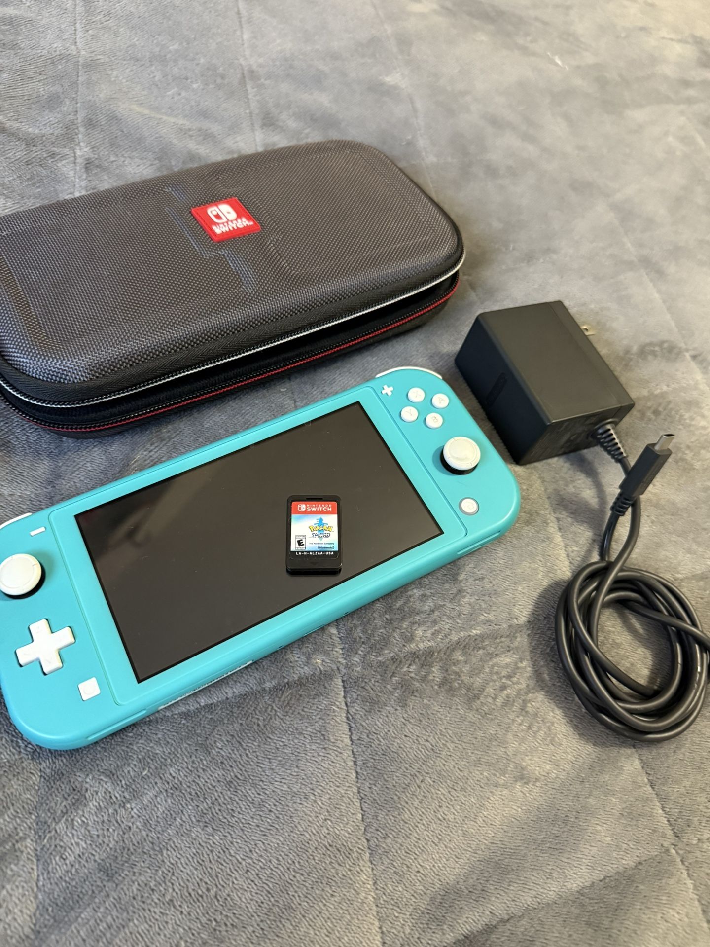 Nintendo Switch Lite W/ Case Charger and Pokemon Game