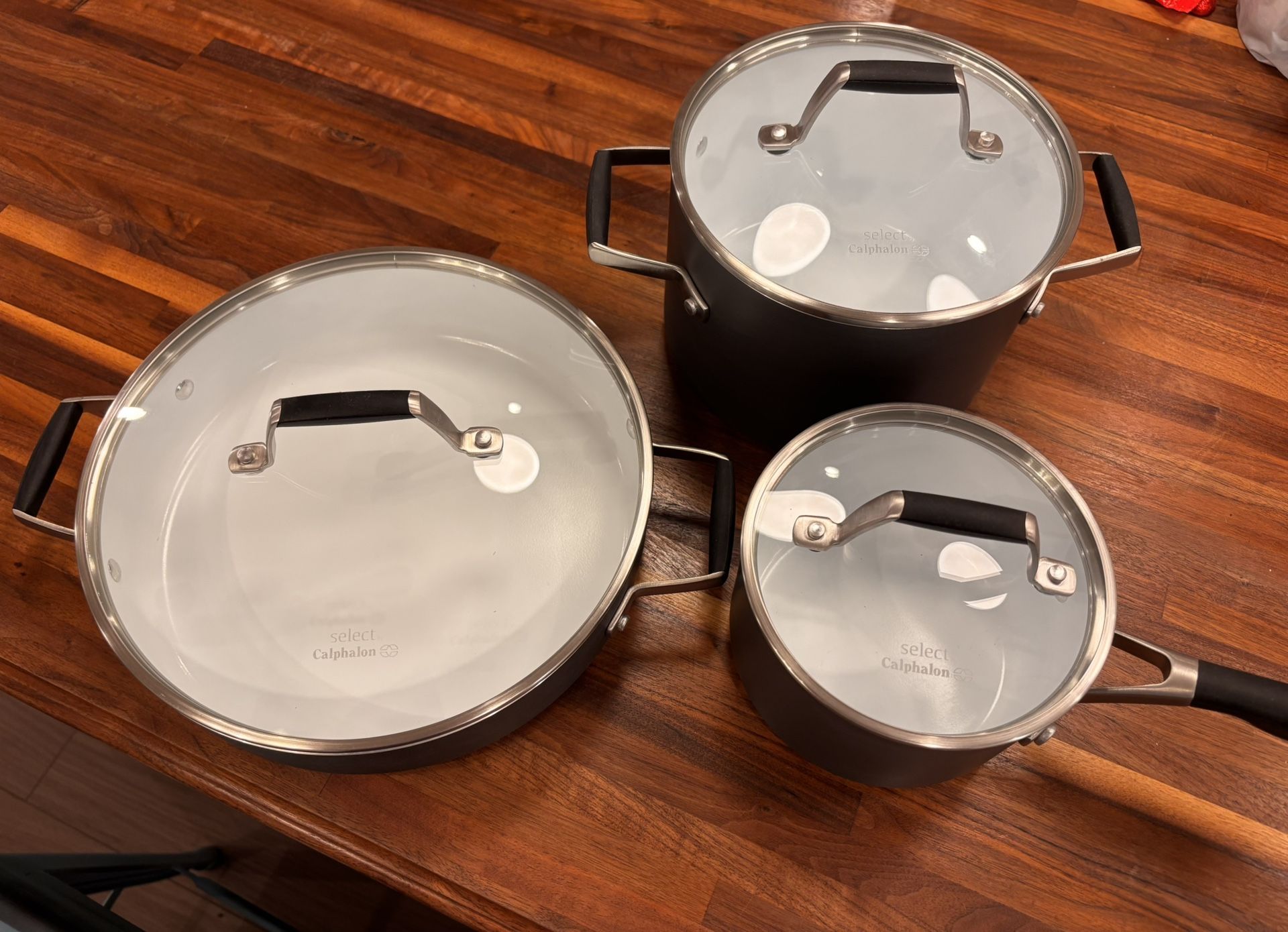 Brand New Calphalon Ceramic Non-Stick 1.5 and 3.5 quart saucepans with glass lids, 3 quart sauté pan with glass lid