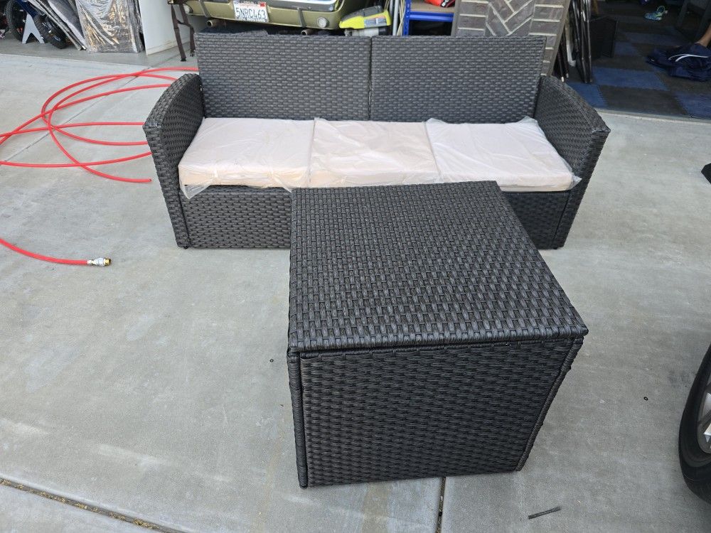 Wicker couch with wicker container and cover